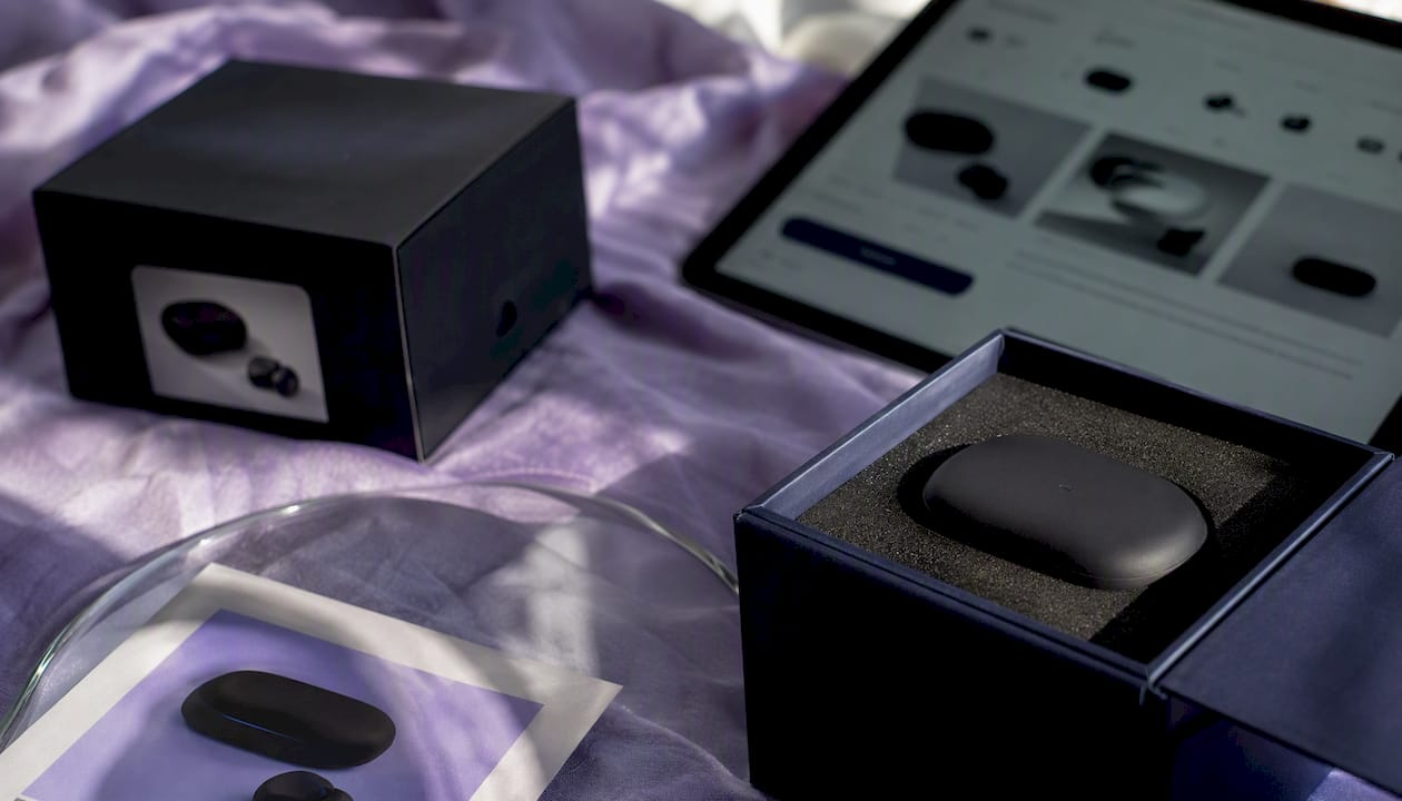 Flat-lay of product packaging and Shopify product page