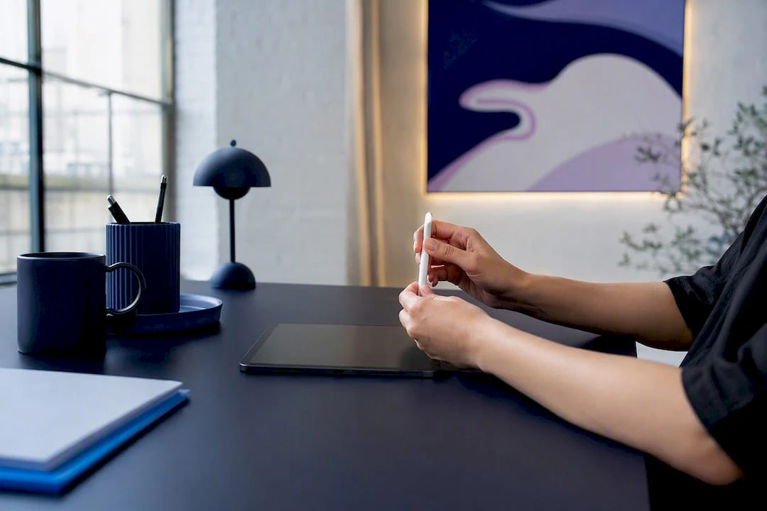 Keyboard and mouse on navy workspace